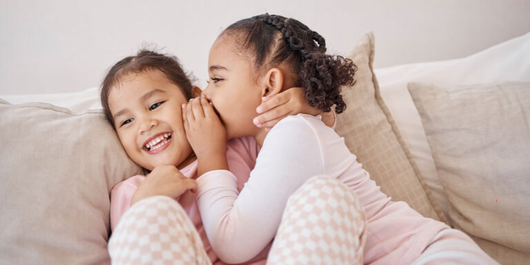 best friends whispering and laughing no sleepover rule