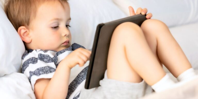 toddler boy on tablet