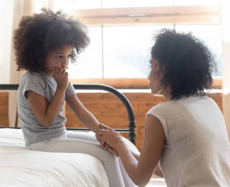 mom comforting unhappy child