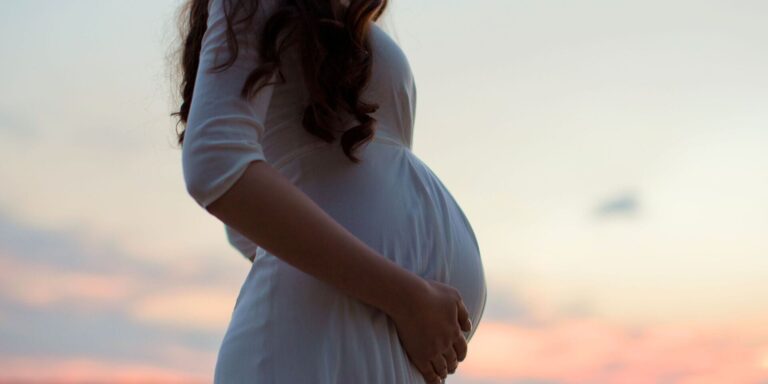 pregnant woman at sunset