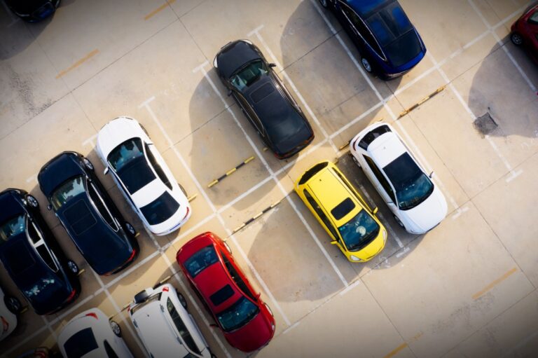 car dealership parking lot above aerial